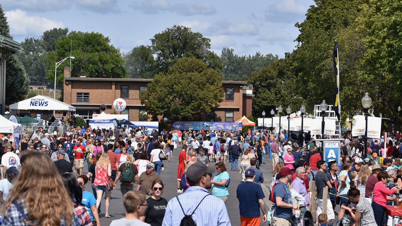 Crowd walks through the NYS Fairgrounds near Chevy Court stage.