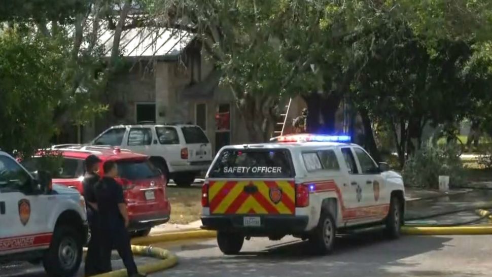 Firefighters on the scene of a residential fire on Johnny Reb Drive in Northwest Side San Antonio in this image from June 12, 2018. (Spectrum News)
