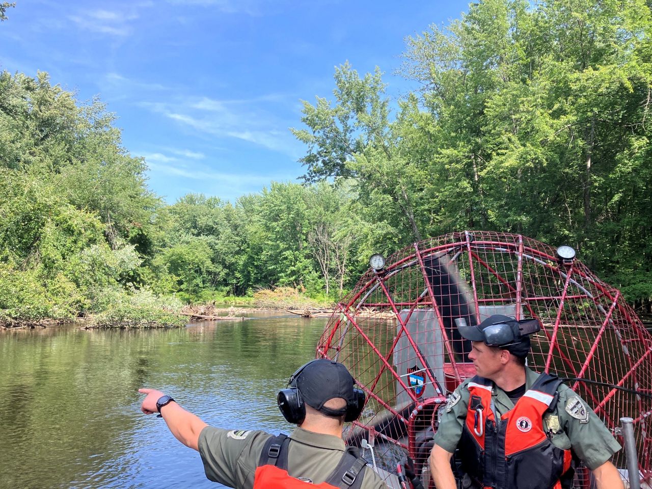 Game wardens use an airboat to access a debris-choked section of the Saco River. (Maine Warden Service photo)