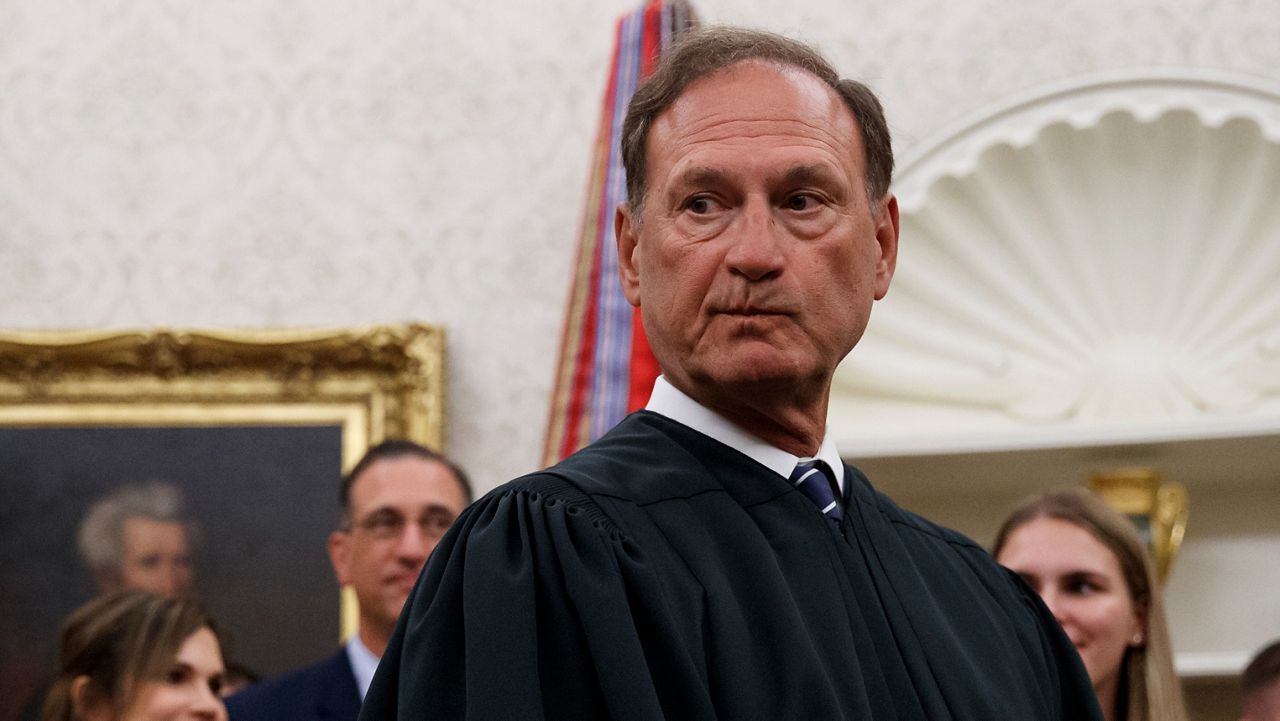 Supreme Court Justice Samuel Alito pauses after swearing in Mark Esper as Secretary of Defense during a ceremony with President Donald Trump in the Oval Office at the White House in Washington, July 23, 2019. A second flag of a type carried by rioters during the attack on the U.S. Capitol on Jan. 6, 2021, was displayed outside a house owned by Alito according to a report published May 22, 2024, by The New York Times. (AP Photo/Carolyn Kaster, File)