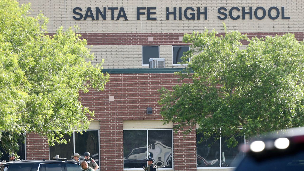 Law enforcement officers respond to Santa Fe High School after an active shooter was reported on campus in Santa Fe, Texas. (Steve Gonzales/Houston Chronicle via AP)