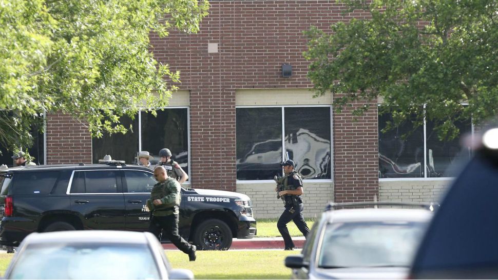 Police on the scene of a mass shooting at Santa Fe High School in Santa Fe, Texas, in this image from May 18, 2018. (Spectrum New/File)