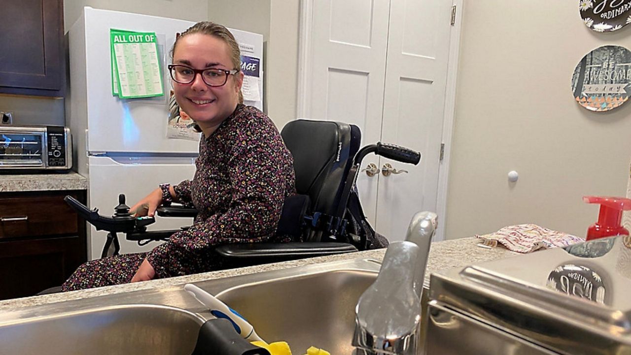 Sara Steimle smiles in her kitchen at Middleburg Heights Creative Living on Sunday, Oct. 31, 2021.