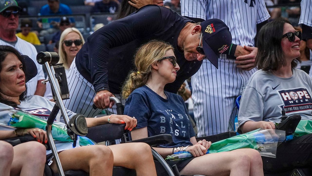 Sarah Langs, who has ALS, honored at Yankees game