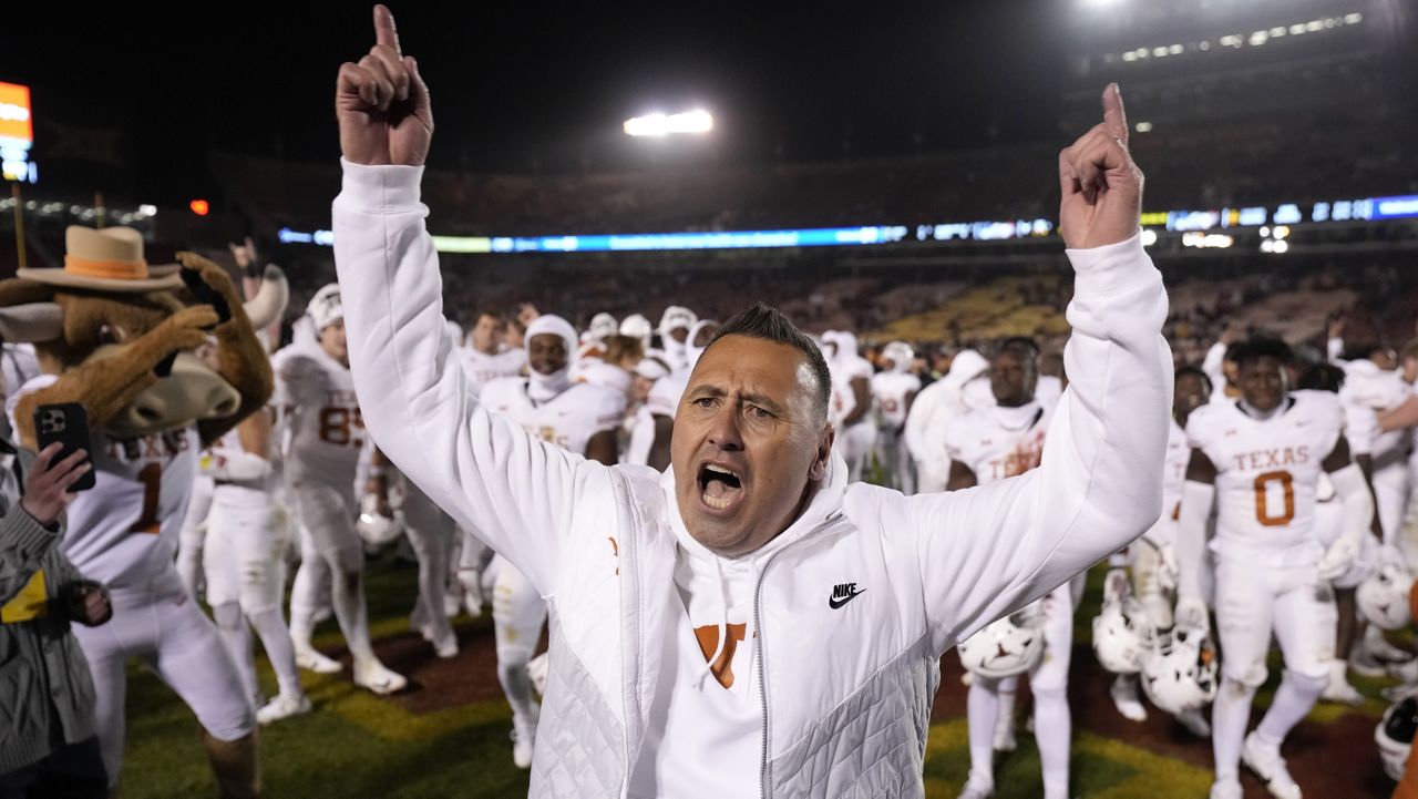 Texas coach Steve Sarkisian celebrates the team's win over Iowa State in an NCAA college football game Nov. 18, 2023, in Ames, Iowa. Sarkisian was voted The Associated Press Big 12 coach of the year. (AP Photo/Matthew Putney, File)