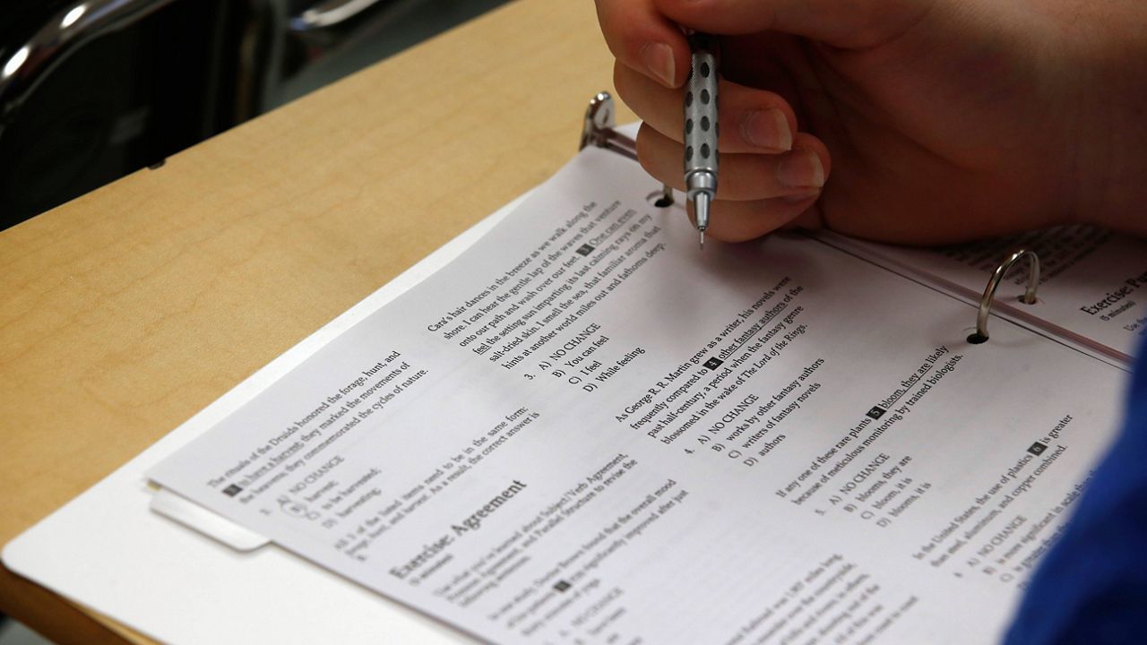 A student looks at questions during a college test preparation class at Holton Arms School in Bethesda, Md. (AP Photo/Alex Brandon, File)