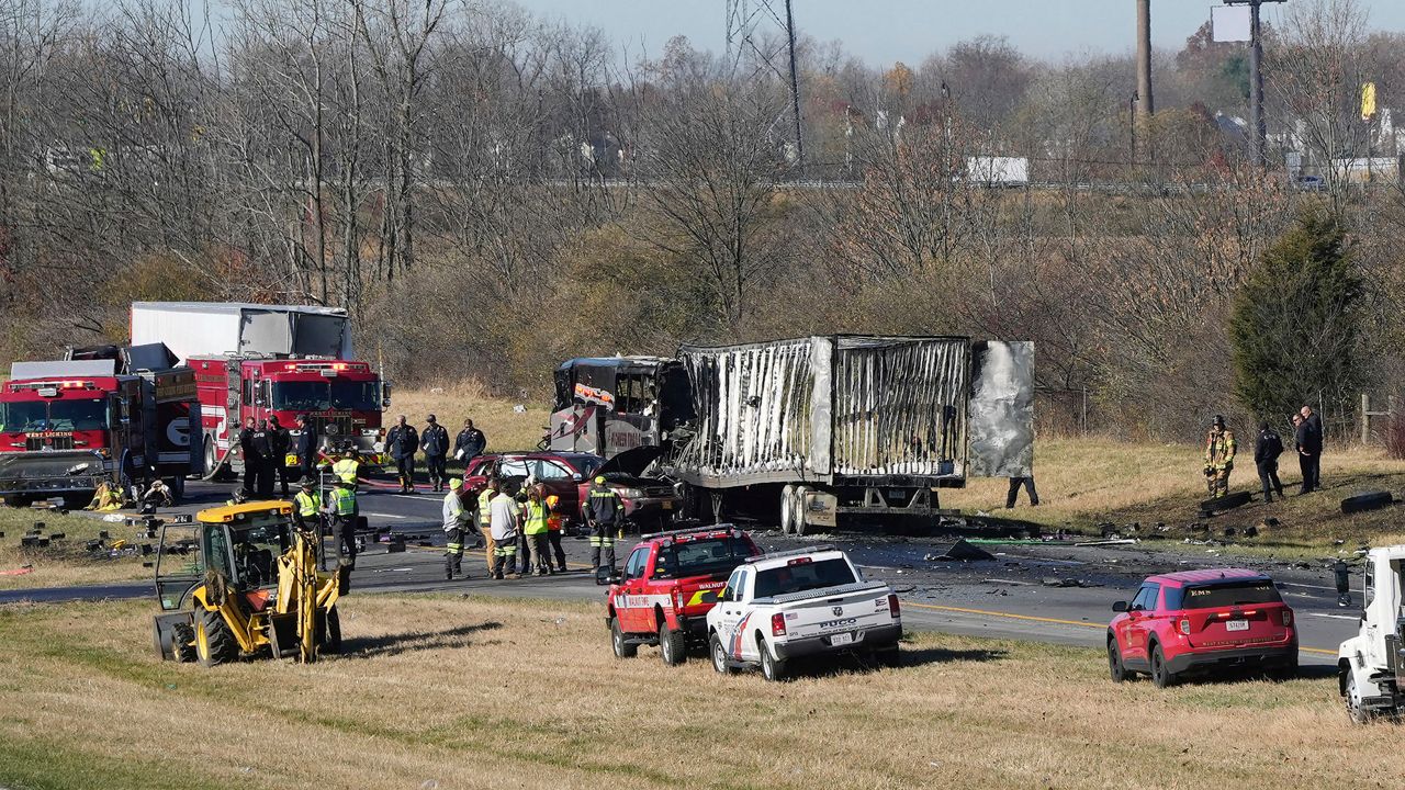 A charter bus carrying students from a high school was rear-ended by a semi-truck on Tuesday, Nov. 14, 2023 on I-70 in Licking County, Ohio. (Barbara Perenic/The Columbus Dispatch via AP)