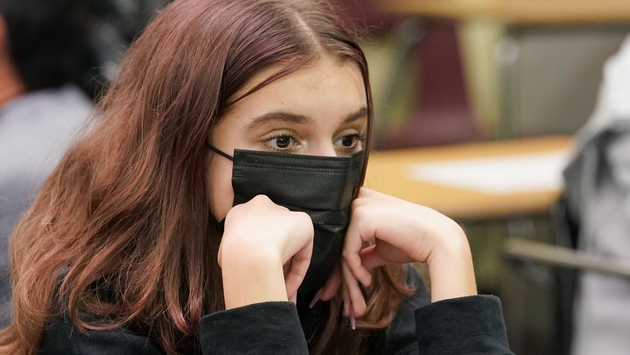 student in school wearing a mask