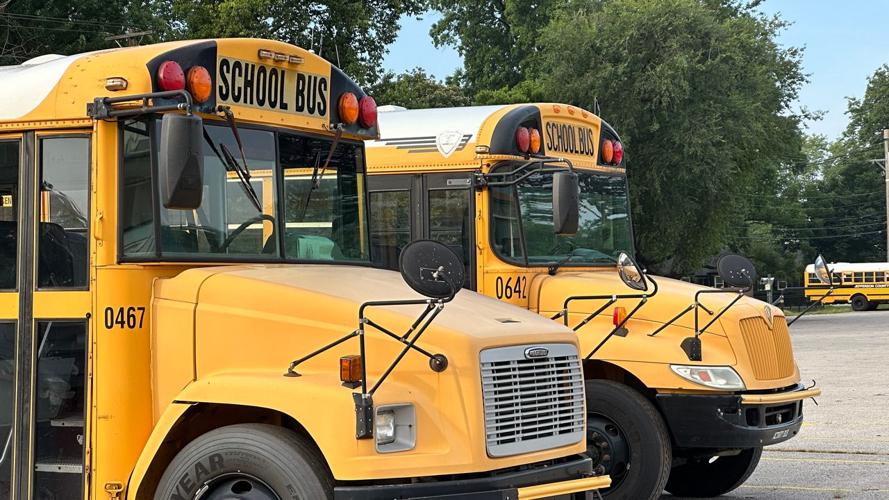 School buses outside a traditional public school. (Spectrum News 1/Juliet Gahan)