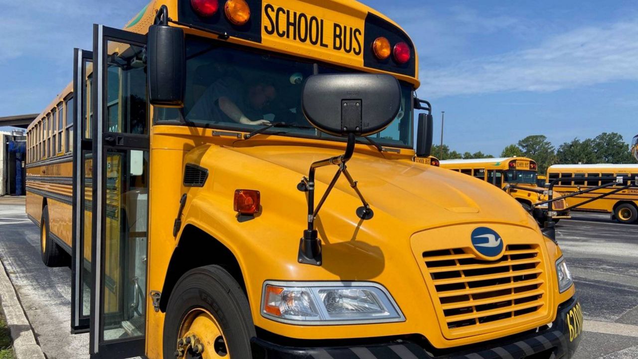 A school bus prepares to pick up students. (File Photo)