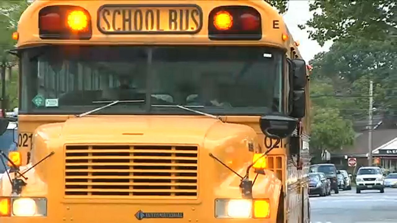 School bus driving down the street (Spectrum News file image)