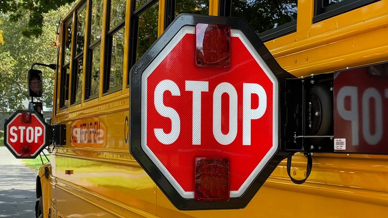 a school bus is shown with stop arm out
