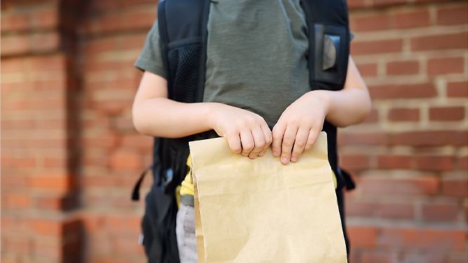 Child with school lunch. (File)