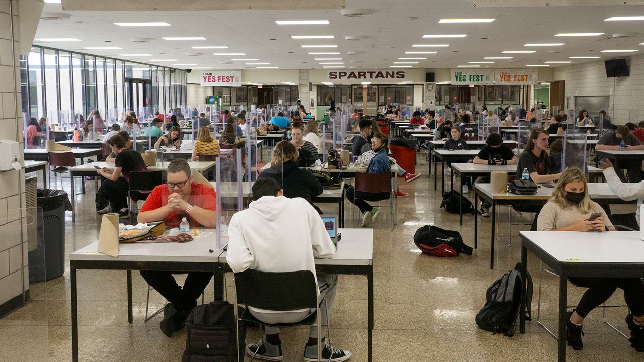 Students wearing masks at school during lunch. (Spectrum File)