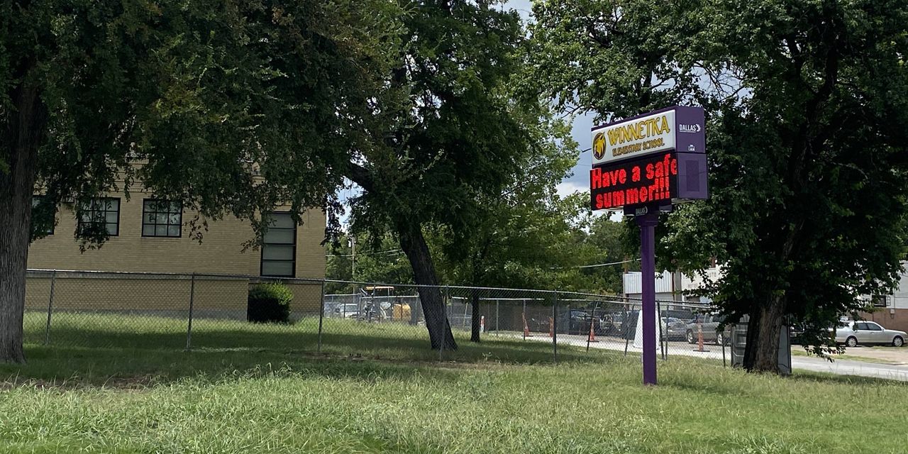 A sign outside Winnetka Elementary School in Oak Cliff, Dallas, flashes "Have a safe summer!!" Area teachers are worried about the region's COVID-19 rates, which are the highest in Dallas. (Photo by Sabra Ayres/Spectrum News)