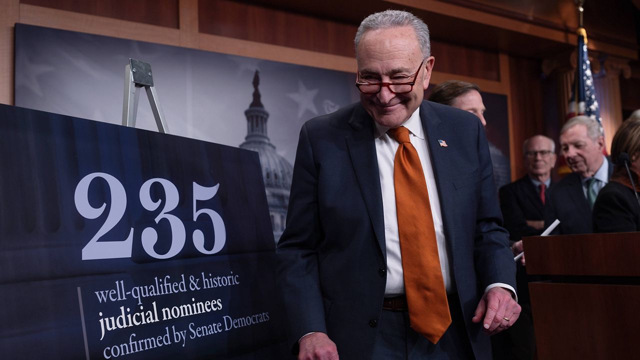 Senate Majority Leader Chuck Schumer, D-N.Y., and members of the Senate Judiciary Committee, meet with reporters to mark the confirmation of 235 federal judges nominated by President Joe Biden during the 118th Congress, at the Capitol in Washington, Friday, Dec. 20, 2024. (AP Photo/J. Scott Applewhite)