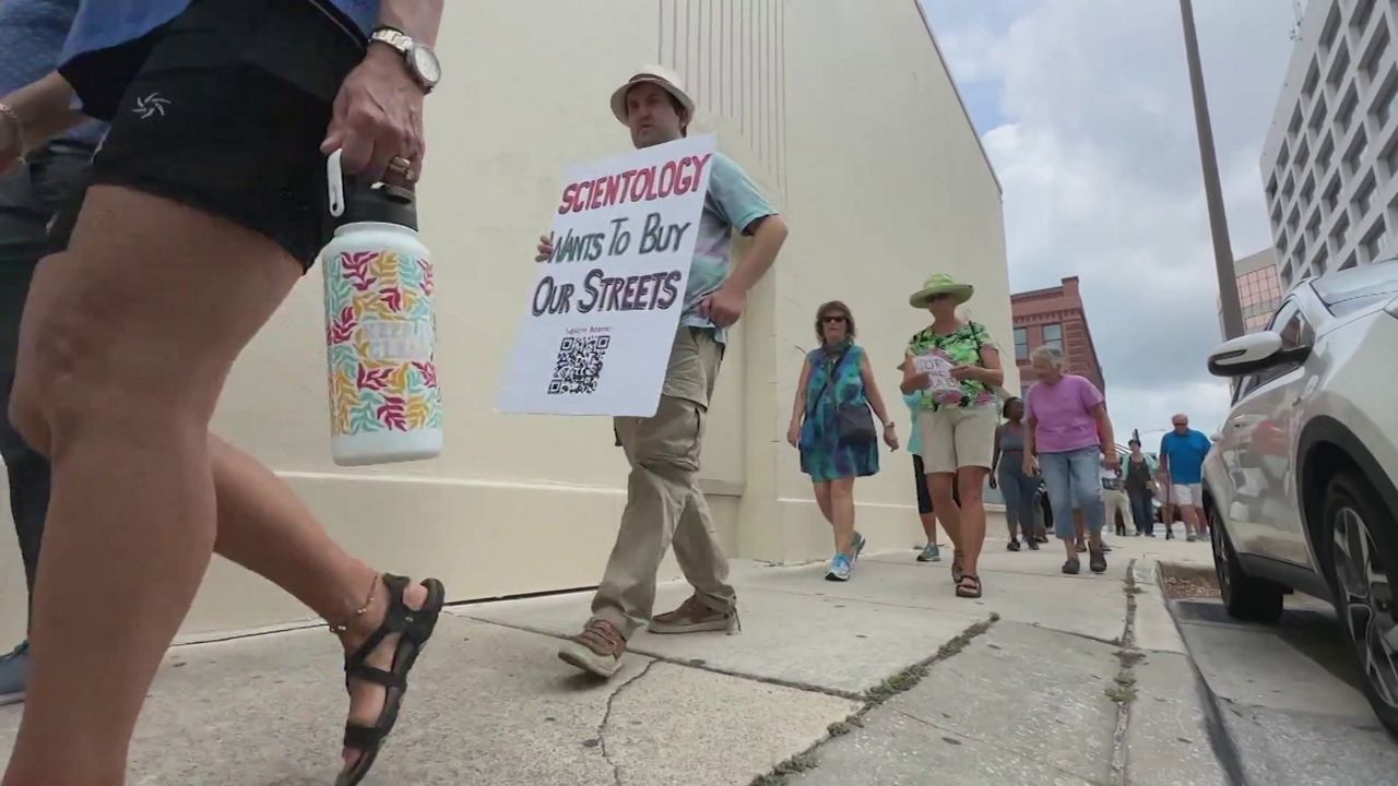 Clearwater residents protest the Church of Scientology's attempt to purchase a South Garden Avenue. (Spectrum News)