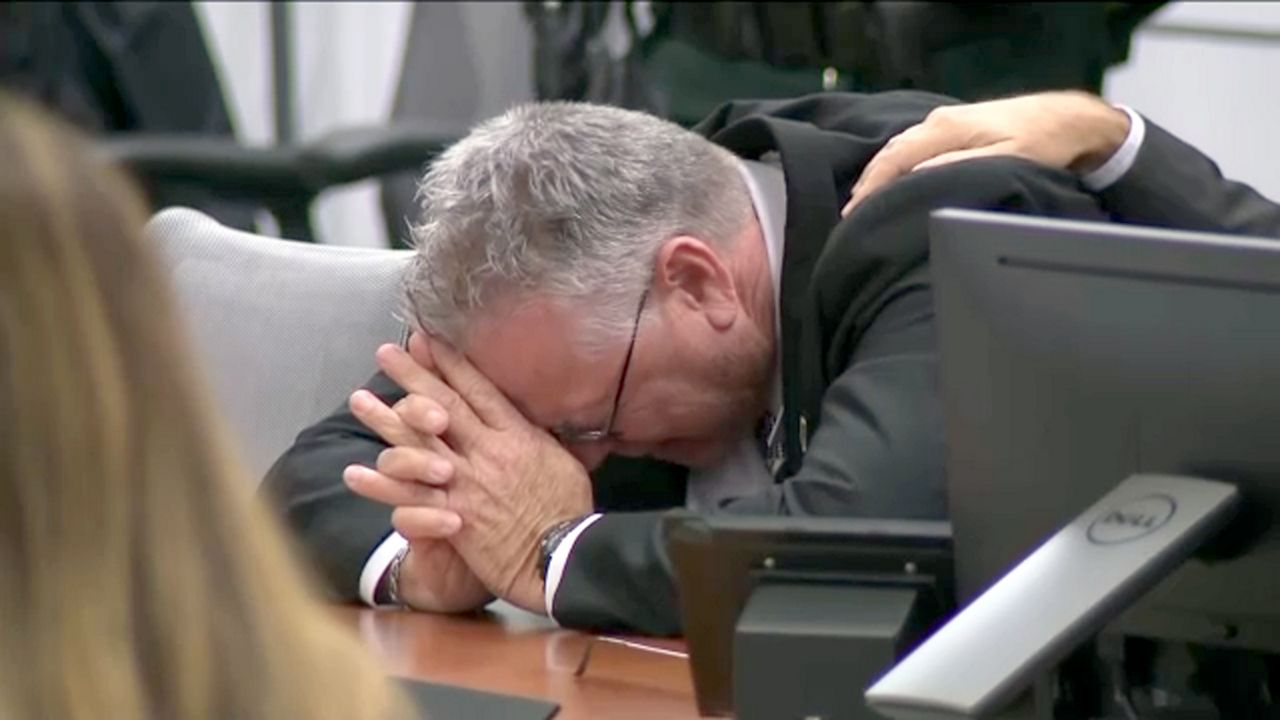 Former Marjory Stoneman Douglas High School resource officer Scot Peterson reacts as not-guilty verdicts are read aloud by the judge Thursday during his trial at the Broward County Courthouse in Fort Lauderdale. (Spectrum News)