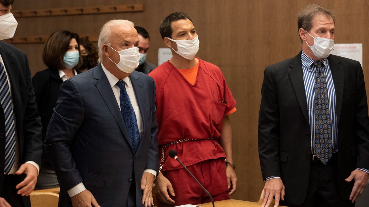 Scott Peterson listens to Stanislaus County Deputy District attorney Dave Harris speak during a hearing at the San Mateo County Superior Court in Redwood City, Calif., Dec. 8, 2021. 