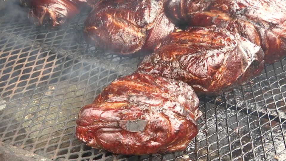 Pork butts smoke at the 2nd annual Sir Walter Smoke Off.
