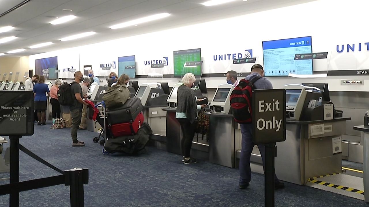 Travelers line up at United Airlines at TPA 
