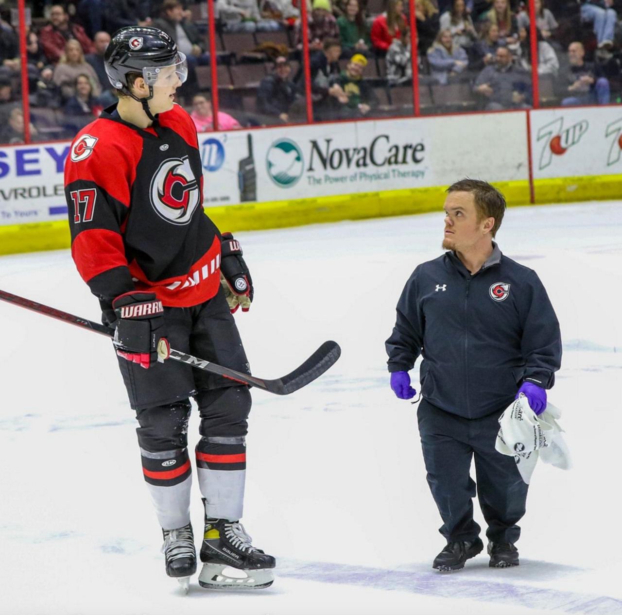 Tim Murray (right) talks to a Cincinnati Cyclones player. Murray monitors the physical health of players before, during and after games and practices. (Photo courtesy of Cincinnati Cyclones/Tony Bailey)