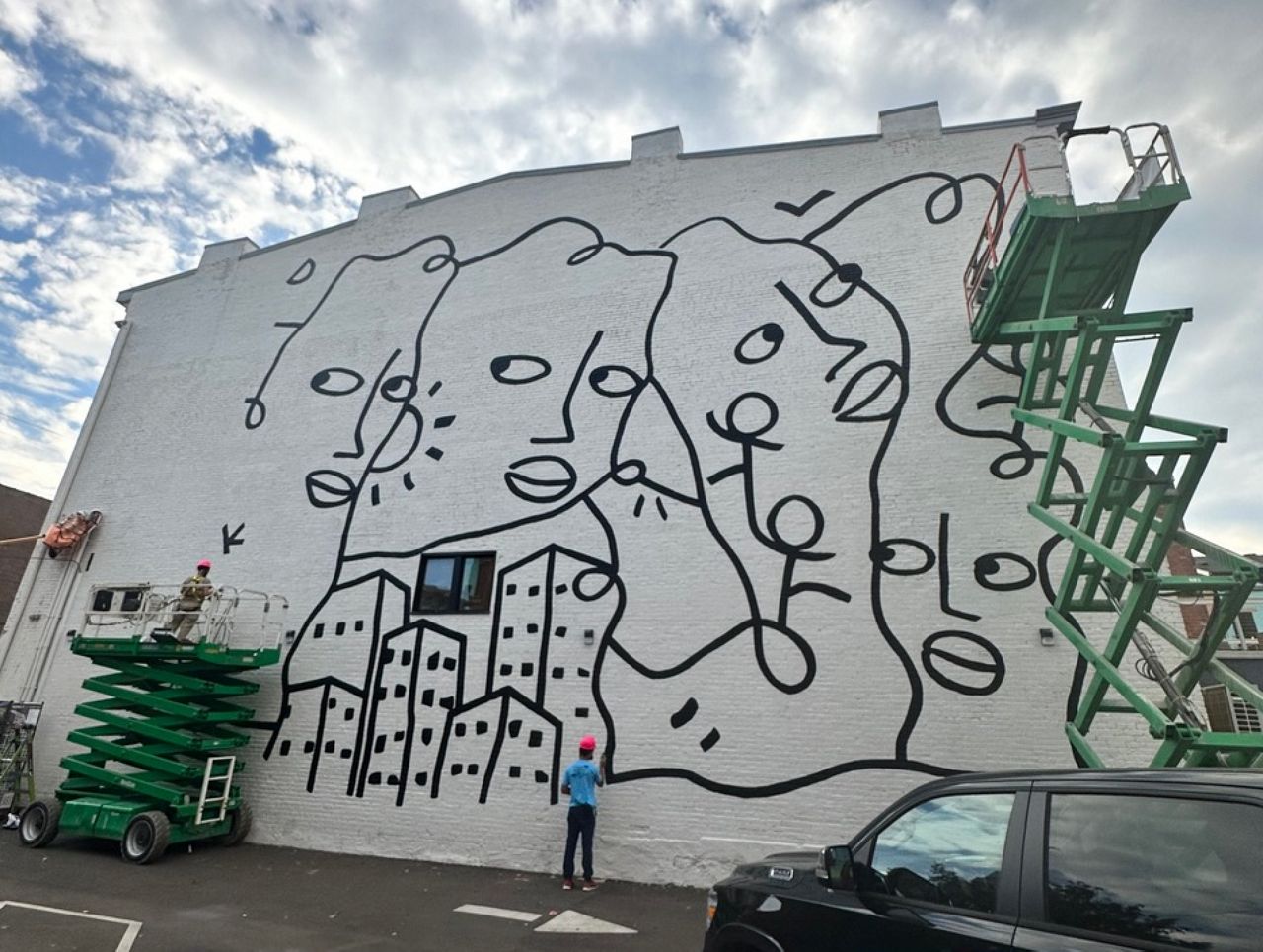 Artists painting Shantell Martin's 'Danke' mural near Findlay Playground in Over-the-Rhine. (Photo courtesy of Shantell Martin)