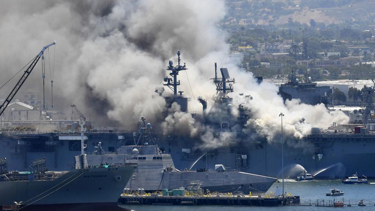 Smoke rises from the USS Bonhomme Richard at Naval Base San Diego in San Diego, after an explosion and fire on board the ship at Naval Base San Diego on July 12, 2020. (AP Photo/Denis Poroy)