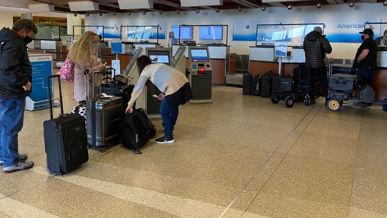 Travelers at Louisville International Airport on Friday. (Spectrum News 1 KY/Adam K. Raymond)
