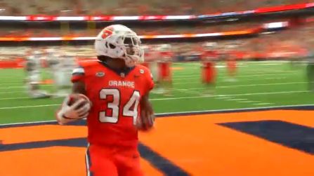 Sean Tucker makes a touchdown on the field in the Carrier Dome.