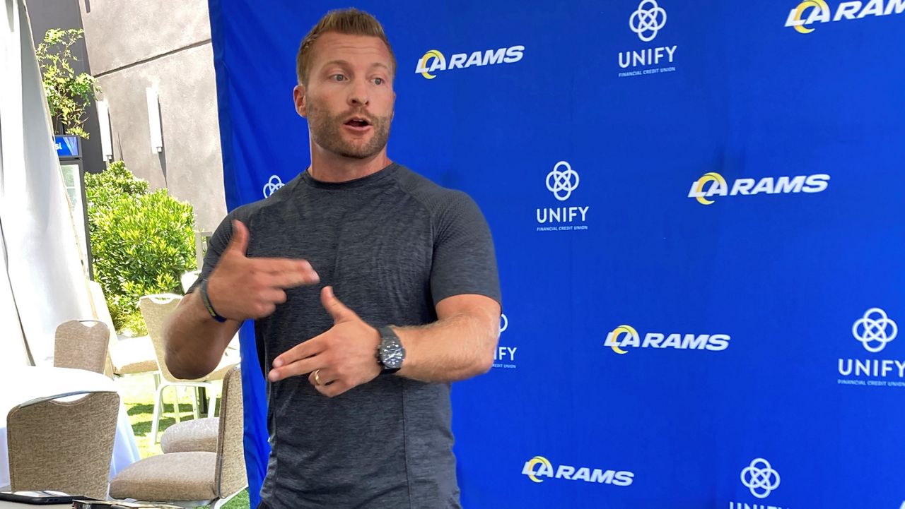 Los Angeles Rams coach Sean McVay speaks with reporters outside the team's training camp headquarters in Newport Beach, Calif., Friday, July 22, 2022. (AP Photo/Greg Beacham)