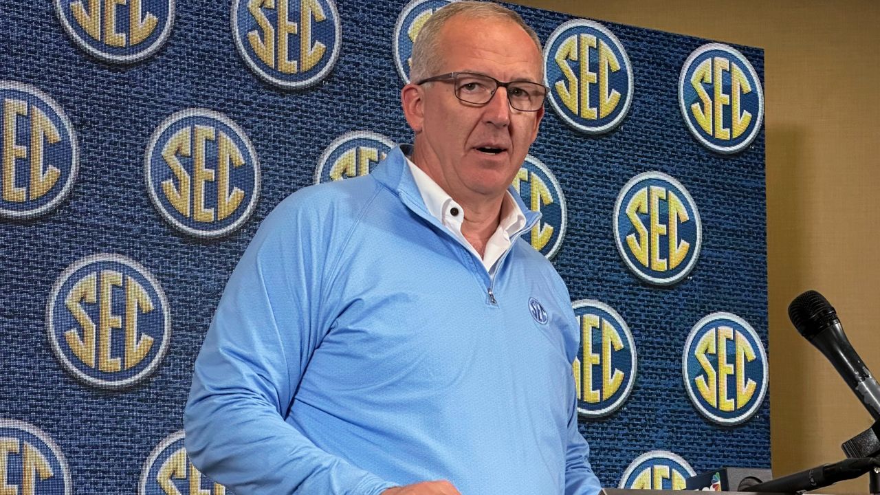 Southeastern Conference Commissioner Greg Sankey speaks to reporters during the conference's spring meetings in Destin, Fla. (AP Photo/Ralph Russo)