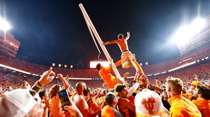 Tennessee fans tear down the goal post after defeating Alabama 52-49 in an NCAA college football game Saturday, Oct. 15, 2022, in Knoxville, Tenn. (AP Photo/Wade Payne)