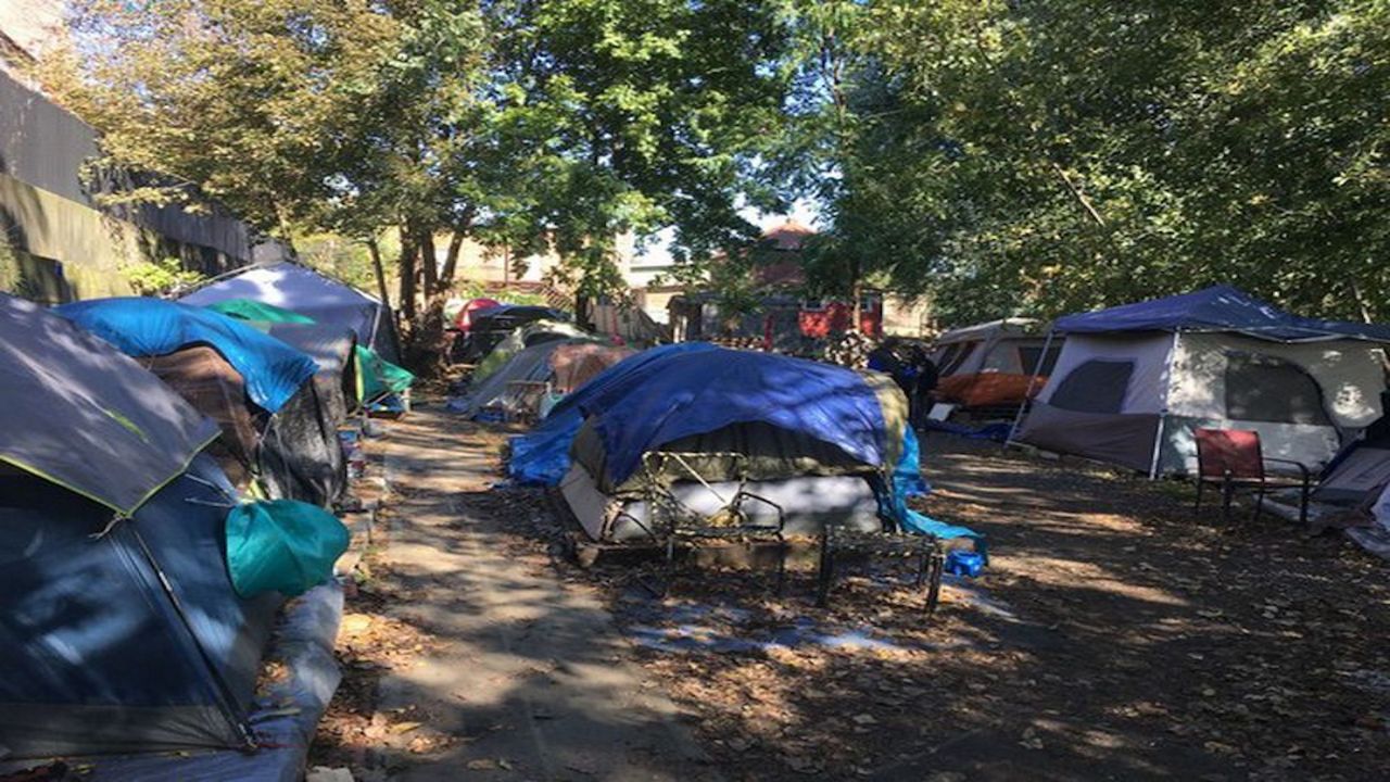 Homeless advocate Sage Lewis housed residents in tents in the backyard of his East Akron property..