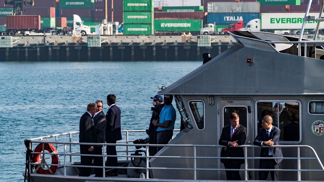 U.S. Secretary of Labor Marty Walsh, second from right, with other officials tours the Port of Los Angeles in San Pedro, Calif., Tuesday, Nov. 30, 2021. (AP Photo/Damian Dovarganes)