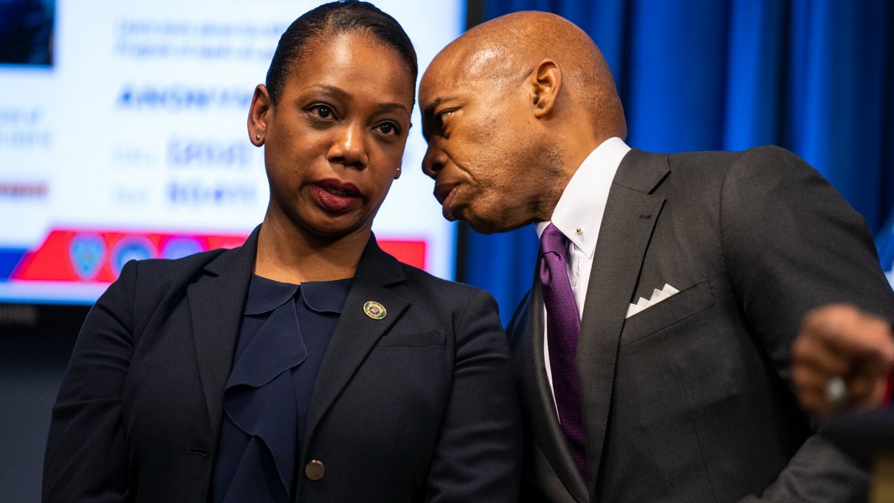 New York Mayor Eric Adams talks with New York City Police Commissioner Keechant Sewell during a news conference, Monday, March 14, 2022, in Washington. (AP Photo/Evan Vucci)