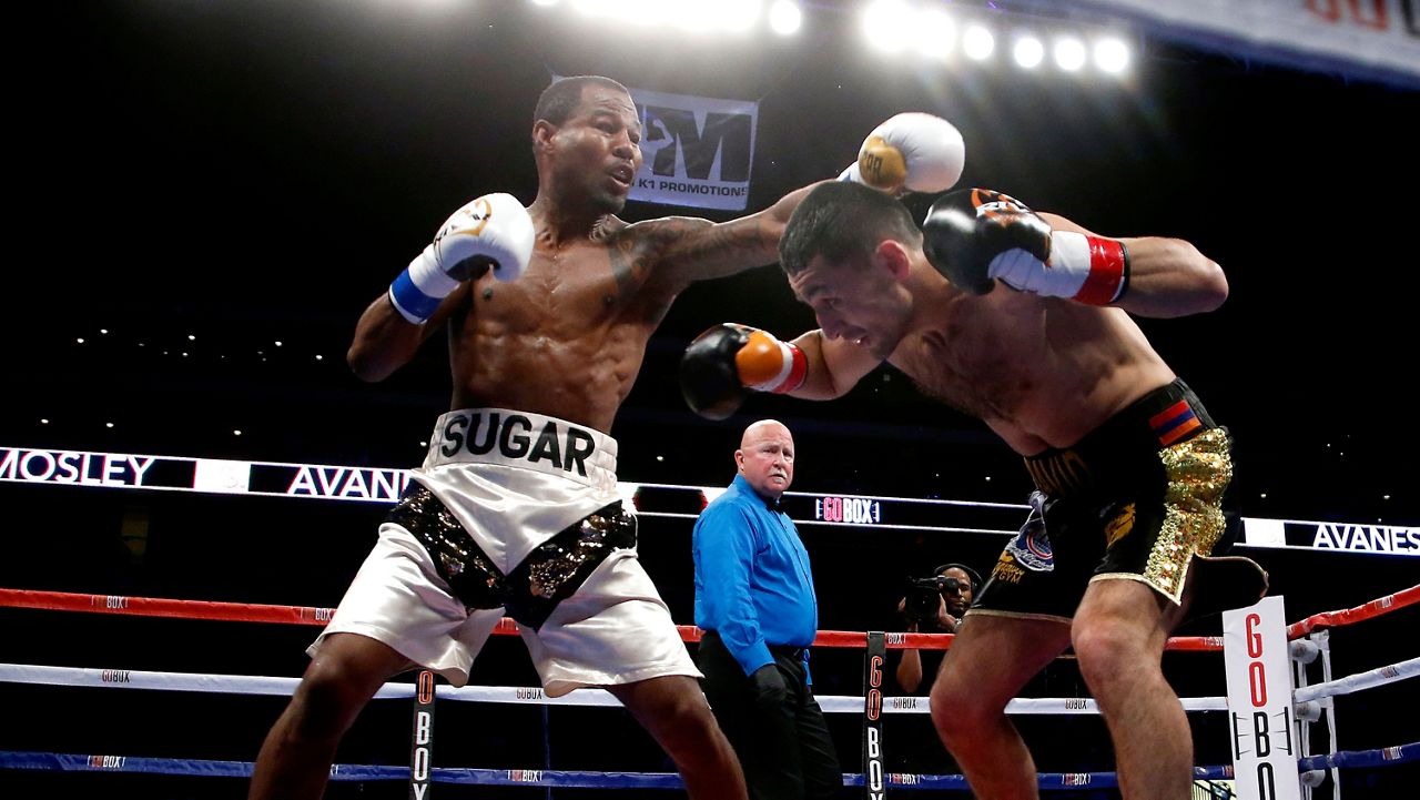 Shane Mosley, left, misses with a left to David Avanesyan during the ninth round of a boxing bout for the WBA interim welterweight title, Saturday, May 28, 2016, in Glendale, Ariz. (AP Photo/Rick Scuteri)