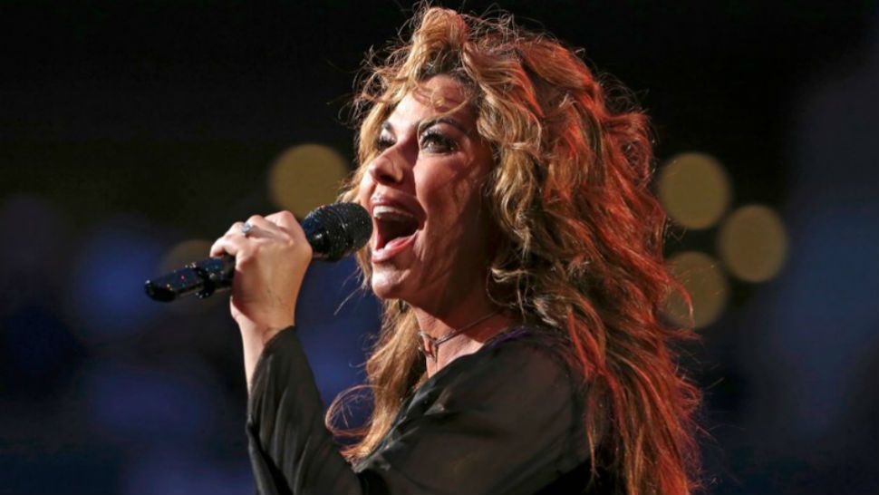 FILE - In this Aug. 28, 2017, file photo, Shania Twain performs during opening ceremonies for the U.S. Open tennis tournament in New York. Twain has apologized for saying if she were American she would have voted for Donald Trump for president, even though he’s offensive. She made the comments in an interview with The Guardian that was published over the weekend. She told the British newspaper “Do you want straight or polite? … I would have voted for a feeling that is transparent.” (AP Photo/Kathy Willens, File)