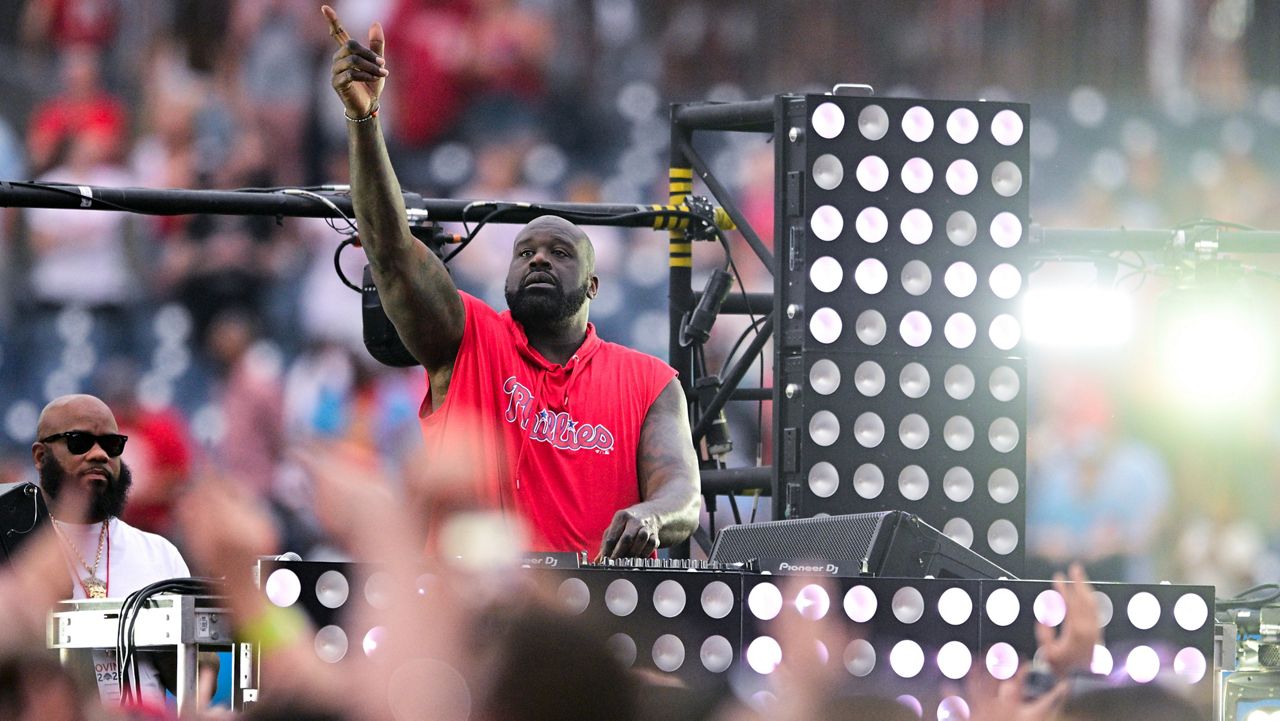 Former NBA basketball player Shaquille O' Neal, who moonlights as DJ Diesel, performs a set following a baseball game. (AP Photo/Derik Hamilton)