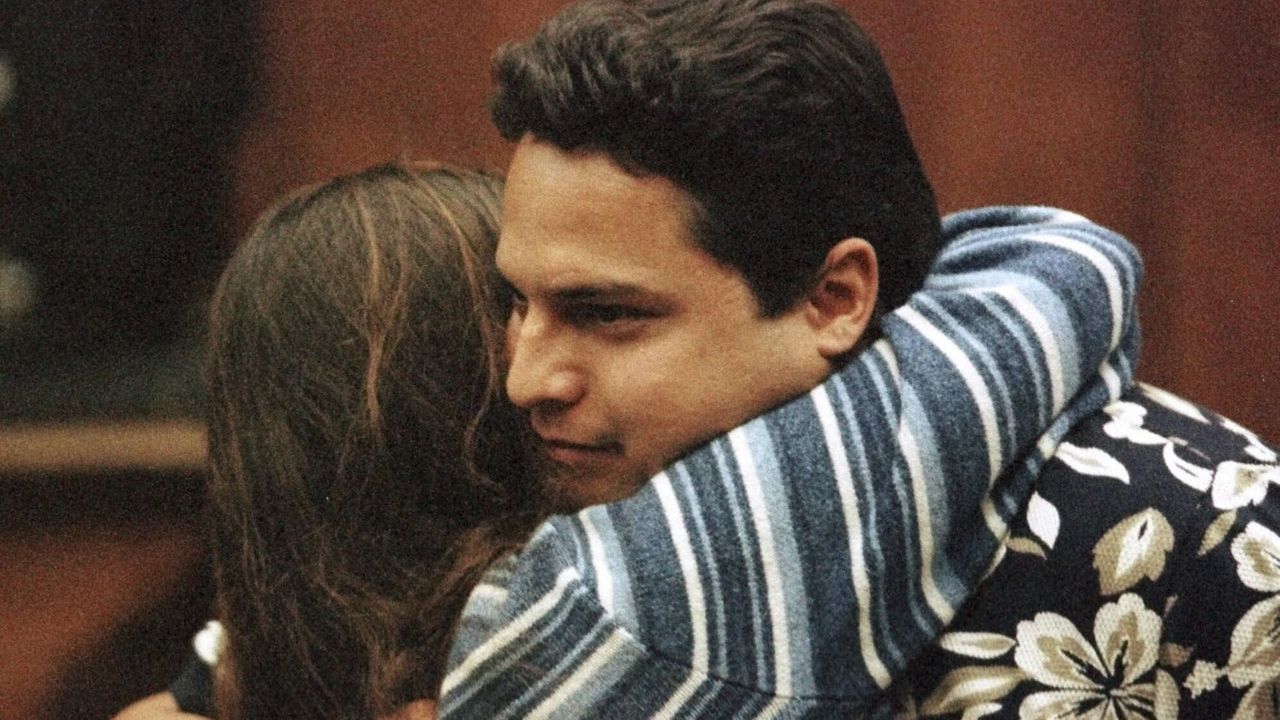 Shawn Schweitzer is embraced by an unidentified woman friend in a Hilo, Hawaii Circuit Court, Tuesday, May 9, 2000, following his sentencing by Judge Rikki May Amano. (William Ing/Hawaii Tribune-Herald via AP, Pool, File)