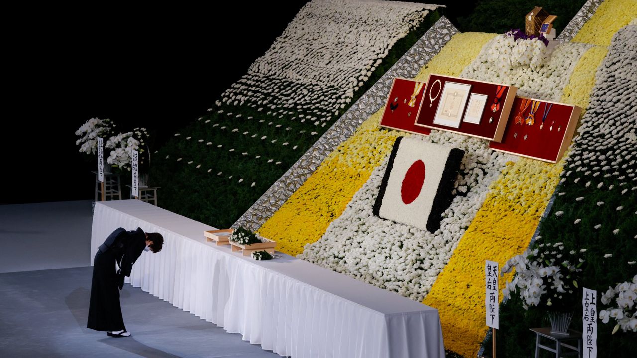 Akie Abe, wife of former Japanese Prime Minister Shinzo Abe, bows at the altar during his state funeral Tuesday in Tokyo. (Kim Kyung-Hoon/Pool Photo via AP)