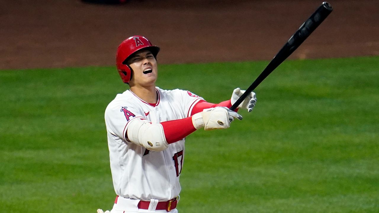 Los Angeles Angels' Shohei Ohtani reacts as he hits a foul ball during the third inning of a baseball game against the Tampa Bay Rays Monday, May 3, 2021, in Anaheim, Calif. (AP Photo/Marcio Jose Sanchez)