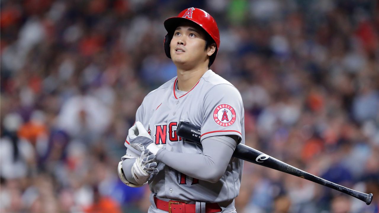 Los Angeles Angels designated hitter Shohei Ohtani reacts after a strike call during his first at-bat against the Houston Astros the first inning of a baseball game Friday, Sept. 9, 2022, in Houston. (AP Photo/Michael Wyke)