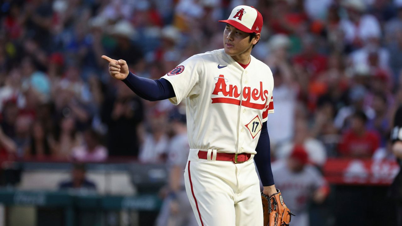Los Angeles Angels starting pitcher Shohei Ohtani signals to his teammates during the fourth inning of the team's baseball game against the Houston Astros on Saturday, Sept. 3, 2022, in Anaheim, Calif. (AP Photo/Raul Romero Jr.)