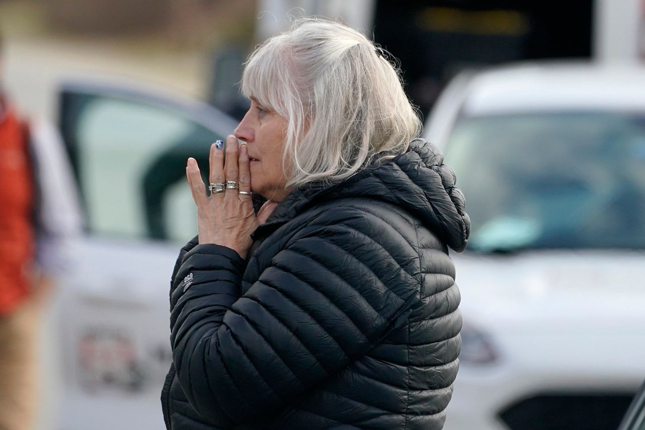 A woman reacts at the scene of a multiple shooting, Tuesday, April 18, in Bowdoin.(AP Photo/Robert F. Bukaty)