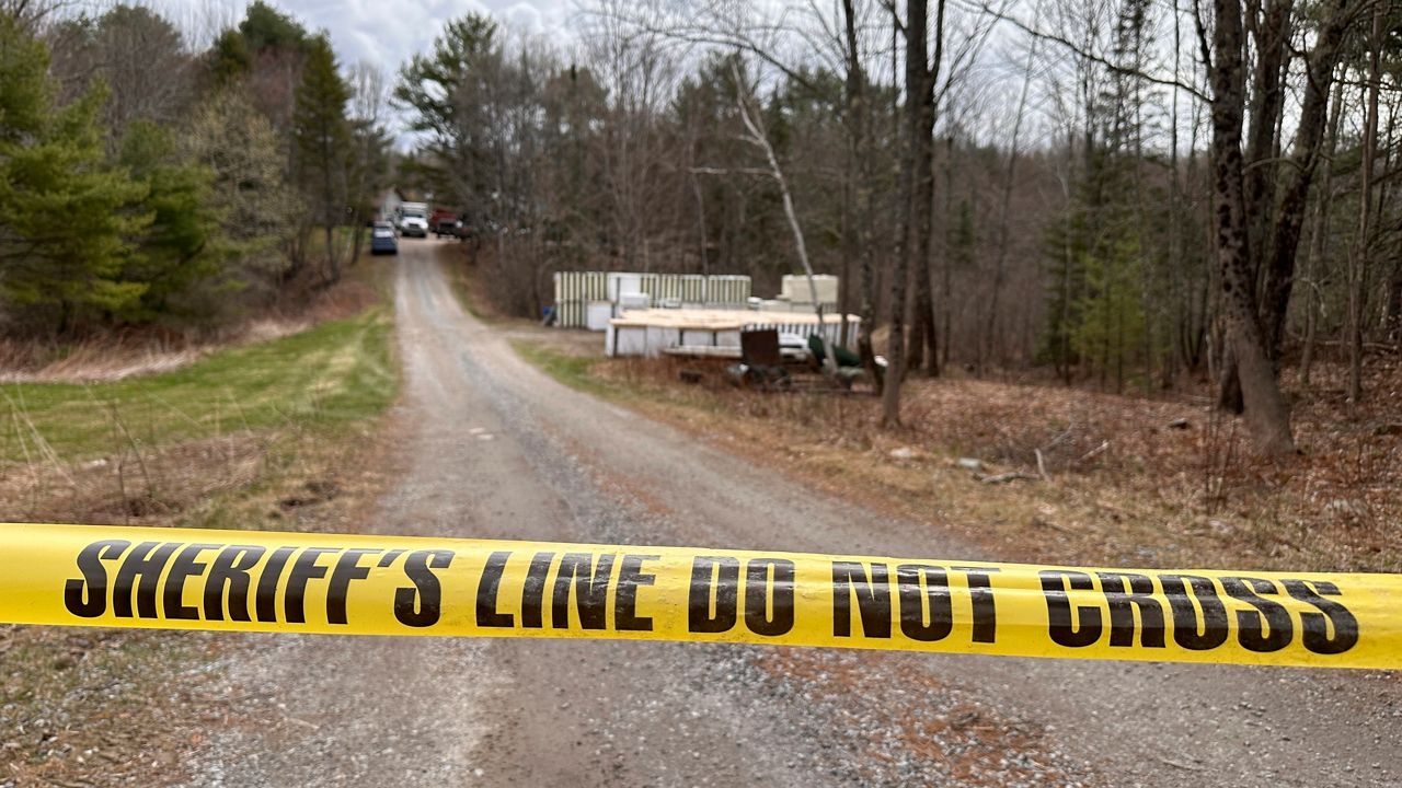 A sheriff's department caution tape is set up at the entrance of a crime scene in Bowdoin, Maine, on Wednesday, April 19. A Maine man who police say killed four people in a home and then shot three others randomly on a busy highway had been released days earlier from prison, a state official said Wednesday. (AP Photo/Rodrique Ngowi)