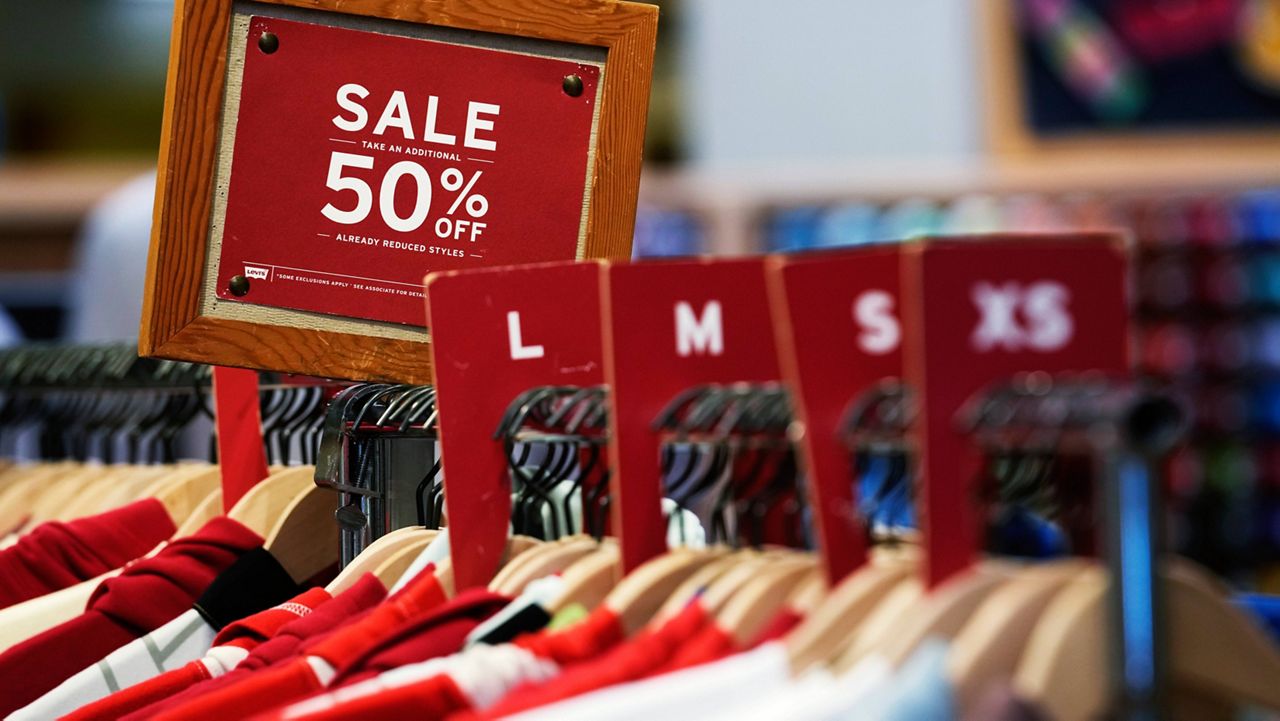 A sale sign is displayed on a rack of clothes at a store in Chicago, Monday, June 10, 2024. (AP Photo/Nam Y. Huh, File)