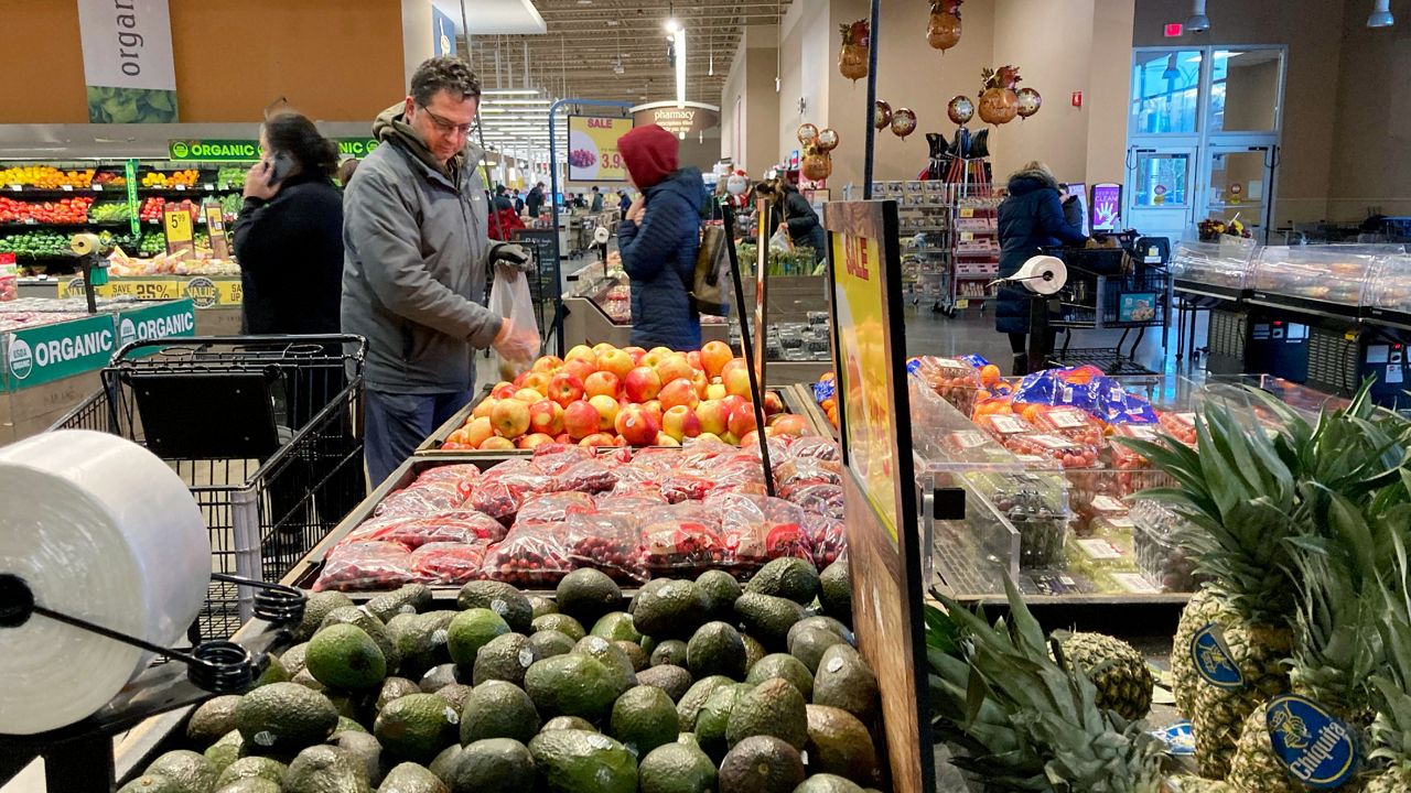 Shoppers pick out items at a grocery store in Glenview, Ill., on Nov. 19, 2022. (AP Photo/Nam Y. Huh, File)