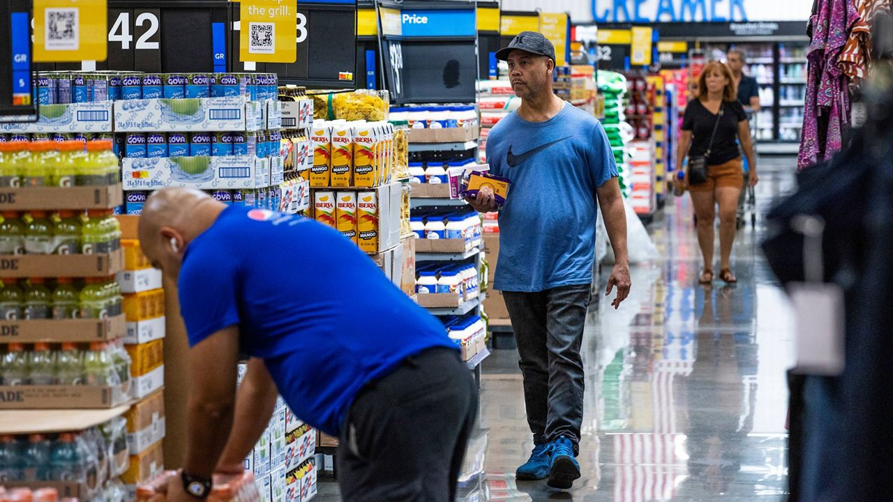 People shop at a Walmart Superstore in Secaucus, New Jersey, July 11, 2024. (AP Photo/Eduardo Munoz Alvarez, File)