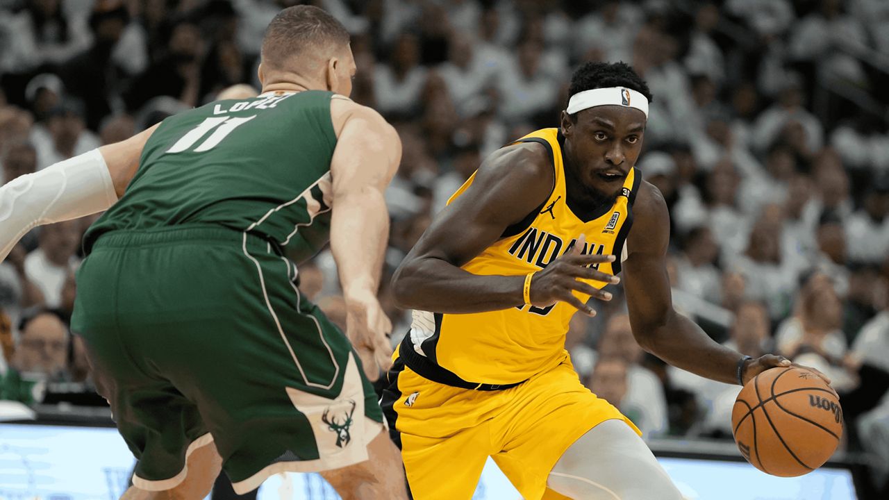 Indiana Pacers' Pascal Siakam tries to get past Milwaukee Bucks' Brook Lopez